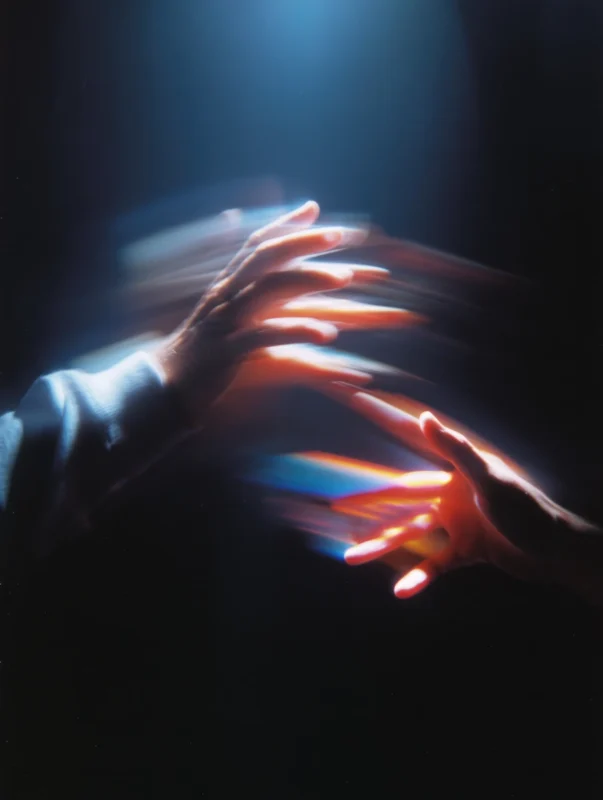 Two hands reaching towards each other, symbolizing collaboration and bridging the gap between theory and practice in education