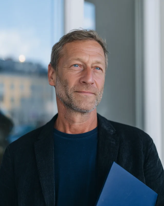 Smiling senior professional, representing approachable expertise and reliability at Space 42